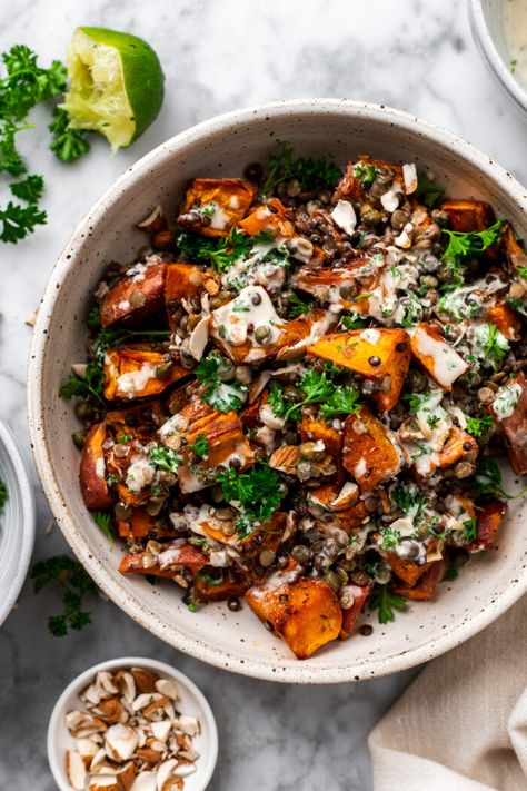 This warm roasted sweet potato lentil salad is a super simple quick sheet pan dinner tossed in a 2 minute roasted garlic tahini dressing, chopped almonds, and fresh parsley. A deliciously flavor-packed healthy meal or side dish that's full of plant protein and satiating fats to serve all week long! Potato Lentil Salad, Roasted Sweet Potato, Salad With Sweet Potato, Lentil Salad, Tahini Dressing, Sheet Pan Dinners, Plant Protein, Easy Healthy Dinners, Roasted Sweet Potatoes