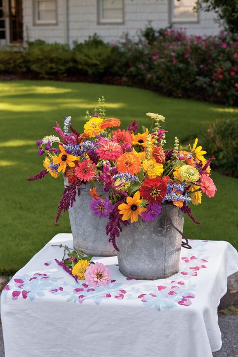 Backyard Blooms | Add a touch of Southern elegance to your home with these colorful flower arrangements. Flowers Bucket, Colorful Flowers Arrangements, Bouquet Champetre, Spring Flower Arrangements, Southern Elegance, Garden Area, Living Coral, Flower Bucket, Cut Flower Garden