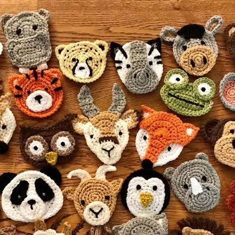 Katy Mitchell | Crochet Designer on Instagram: "All 30 animal appliqués are now finished for my latest design, the Animal Kingdom Blanket 🦁 Here’s the whole gang together! Now to make my mind up which animals are going on which squares and how to arrange them... #animalkingdomblanket Pattern by me 🙋‍♀️ Coming soon! #crochet #crochetproject #crochetdesign #crochetdesigner #crochetpatterndesigner #crochetpattern #crochetanimals #crochetappliques #crochetmotif #crochetersofinstagram #crochetersofig #crochetersoftheworld #instacrochet #crochetgram #crochetrevolution #crochetgirlgang #creativecommunityhub #makersgonnamake #sctreblemaker #lovecrochet #crochetaddict #hookedoncrochet #crochetcrazy #crocheterapia #crochetastherapy #craftastherapy #crochet_relax #crochetideas #crochetinspirati Crochet Animal Motifs, Crochet Animal Faces, Crochet Animal Applique, Crochet Animal Blanket, Animal Granny Squares, Appliques Au Crochet, Granny Square Pattern Free, Crochet Applique Patterns Free, Granny Square Cardigan