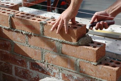 This simple guide will show you the basics of how to properly mix cement mortar and lay bricks. I will also go over what bricklaying tools you need, especially when you're just starting out. Building A Brick Wall, Mortar Repair, Brick Planter, London Brick, Easy Home Improvement Projects, Brick Laying, Masonry Work, Brick Masonry, A Brick Wall