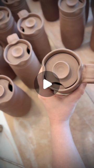 Dault Pottery on Instagram: "We need your help answering a question although as I type this out…I’m pretty sure David’s opinion is going to win…  Should there be a drinking spot carved into both sides  of the travel mug making them work for both right and left handed people OR should we keep it to only one side but let people choose their preference?  I personally don’t like the way the mug looks when I carve both sides out because visually it’s just too busy and it seems too open.  David makes the argument that if we go ahead and make them ambidextrous, they would be way more practical and functional and it would eliminate any need to keep track of who needs a left handed mug.  What do you think about it?" Throwing Techniques Pottery, Pottery Travel Mug Ideas, Ceramic Takeaway Cup, Travel Mug Pottery, Ceramic Travel Mug With Lid, Throwing Mugs On The Wheel, Carved Pottery Mugs, Ceramic To Go Mug, Pottery Wheel Mug