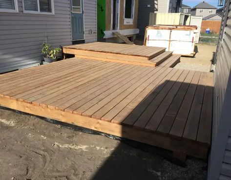 How to Build a Floating Deck (Step by Step Guide) - Decks by E3 Build A Floating Deck, Fence Post Installation, Outdoor Deck Design, Deck Step, Deck Building Plans, Building A Floating Deck, Deck Design Ideas, Platform Deck, Raised Deck