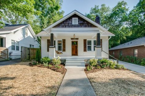 White Brick Craftsman with Dark Wood Accent Colors White Craftsman House, Brick Craftsman House, Beach Bungalow Exterior, Exterior Home Colors, White Paint House, White Craftsman, Craftsman Bungalow Exterior, Craftsman Houses, Painted Brick Exteriors