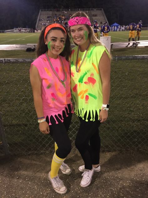 Neon themed football game!! 80s Football Theme, Glow Football Game Theme, Neon Hoco Theme Outfit, Neon Dance Outfit School, Neon Football Game Outfit, Neon Outfit Ideas For Football Games, Neon Football Game Theme Outfit Paint, Spirt Week Ideas Outfits Neon, Neon Cheer Theme