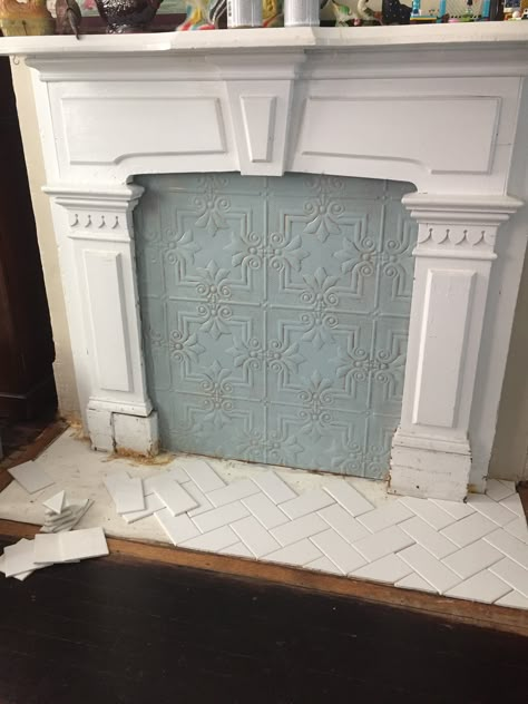 Painted plastic “faux tin" fireplace cover with herringbone tile Cover Fireplace Tiles, Tin Tile Fireplace Surround, Cover For Fireplace Opening, Fireplace Covering Ideas, Faux Victorian Fireplace, Fireplace Screen Ideas Farmhouse, Covered Fireplace Ideas, Diy Fireplace Cover Ideas, Cover Fireplace Opening