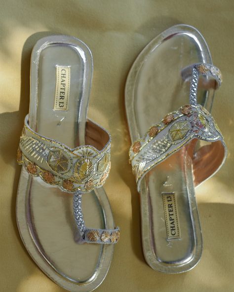 •Soona Chandi Elevate your style with our Kohlapuri sandals, handcrafted in Rose Gold, Gold, and Silver. Each pair features unique Mukaish embroidery and a handcrafted silver rexene braid. The shiny golden insole and anti-skid sole add a touch of luxury and comfort to every step. Experience the beauty and quality of our Soona Chandi today CAPSULE COLLECTION ’24 Shop online: www.chapter13online.com Available at @millishoes 71 The Mall, Mall Road Lahore #newarrivals #khussas #chapter13 #shoes Mukaish Embroidery, Silk Bottoms, Office Shoes, Women Office, Crop Image, Capsule Collection, Professional Photography, Light Photography, Gold Gold