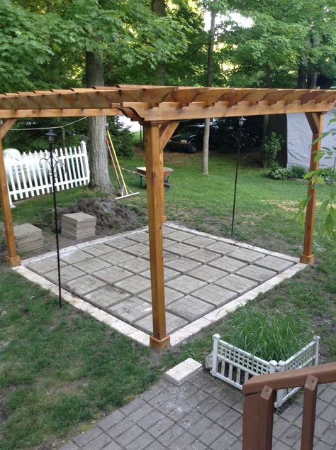 Adding patio stones under a pergola is a bit cheaper than the flagstone if your on a tighter budget.i used 2 different kinds for it,and will add pea gravel with gator dust locking sand to finish it. Gravel Patio With Pergola, Gazebo On Gravel, Pergola Paver Patio, Fancy Pergola Ideas, Gravel Patio With Gazebo, Pea Gravel Patio With Pergola, Stone Patio With Pergola, Pergola In Yard, 10x10 Patio Ideas Outdoor