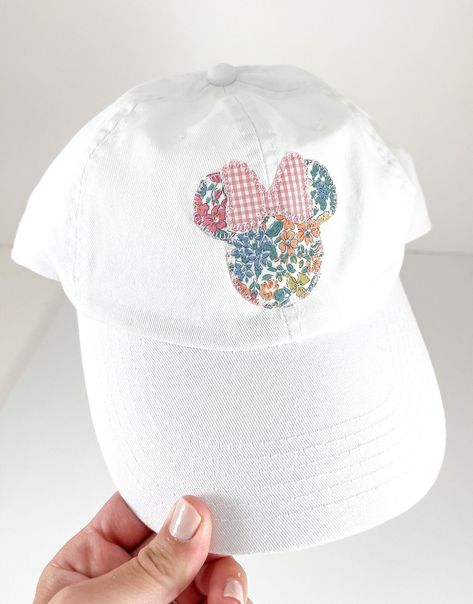 "WELCOME TO HADLEY AND FINN  Product Details: Girl Mouse Ears on Children or Adults White Hat  Applique Description: Floral Girl Mouse Ears with Pink Gingham Bow  Product Sizing:   Children Fits Ages 2T - 10, and Adults                                Children's Hat is adjustable: head circumference measures 20\" - 24\"  Product Care:  We do not recommend washing Order Processing Time: Listed in Shipping Options  Social Media: Follow us on Instagram Contact The Owners: Send us a conversation on E Hand Stitched Disney Shirt, Disneyworld 2024, Disney Applique, Bow Applique, Disney 2023, Disney 2024, Magical Boy, Machine Applique Designs, Magical Accessories