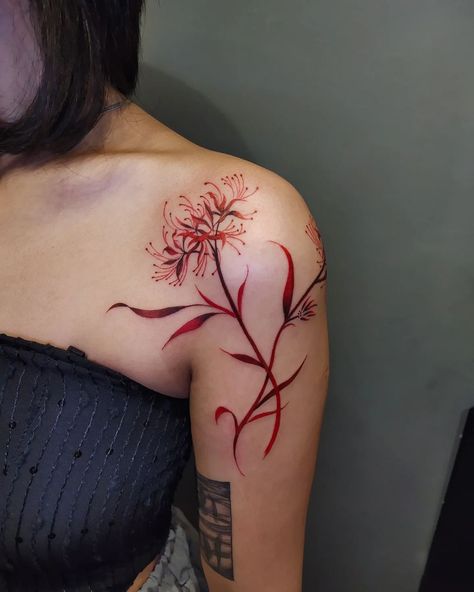 12 Red Tattoo Ideas You'll Want To Steal And Recreate Small Tattoo Female, Red Ink Back Tattoo, Jj Tattoo, Red Spider Lily Tattoo, Red Tiger Lily, Spider Lily Tattoo, Red Flower Tattoos, A Small Tattoo, Red Tattoo Ideas