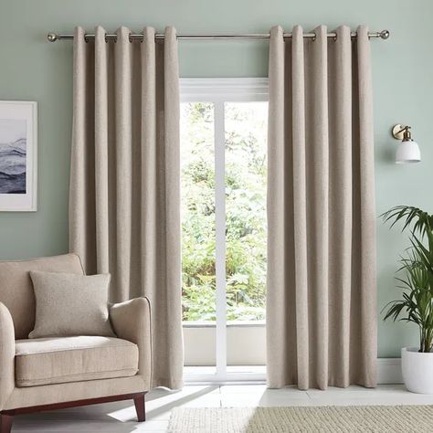 Beige curtains and a beige club chair in an elegant living room with light green walls. Curtains To Match Green Walls, Beige Curtains Living Room, Lounge Curtains, Green Walls Living Room, Blue Sofas, Curtains Style, Light Green Walls, Beige Curtains, Aesthetic Living Room