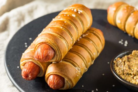 Pigs in a blanket are hot dogs filled with cheese and baked in a crescent roll wrap. Top them with an egg wash or poppy seeds for a twist. Crescent Wrapped Hot Dogs, Pigs In A Blanket Recipe Pillsbury, Hot Dog Crescent Rolls, Easy Crescent Rolls, Wrapped Hot Dogs, Hot Dog Rolls, Gluten Free Pretzels, Homemade Pretzels, Crescent Roll Recipes