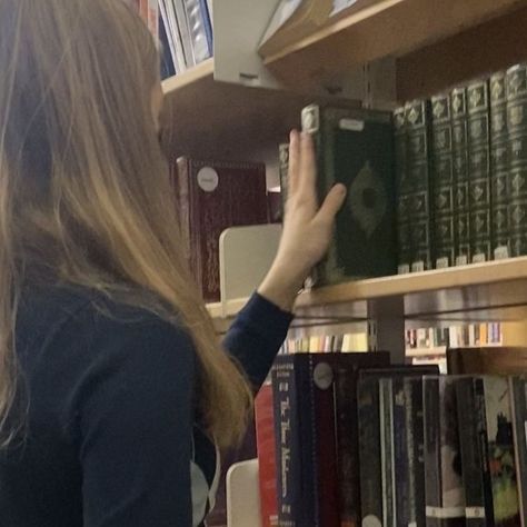 browsing in a library, picking your next read, reading motivation and inspo