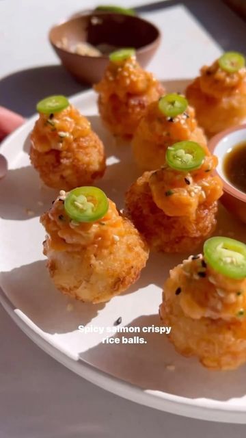 Foodsteer on Instagram: "Spicy Salmon Crispy Rice Balls 🤤 Perfect for appetizer season! Ingredients: •8 oz sushi grade salmon. •1/4 c japanese mayo (kewpie). •2 tbsp sriracha (adjust if you want it less spicy). •1 tsp sesame oil. •1 tsp tamari. •1/2 tsp sugar. •1 tsp white miso paste. •1/4 c chives (finely chopped and adjust if you want less). •serrano pepper slices to taste. •black and white sesame seeds to taste. •1 cup calrose rice (wash it really well, 3-4 times until the water is no longer white. Soak it for about 20-30 min and cook in a rice cooker. season it with 3 tbsp rice vin, 2 tbsp cane sugar, pinch of salt). Directions: 1. rub some sesame oil on your hands and form the rice balls. Let sit in the freezer for 40-50 min or until hardened but not fully frozen. 2. add some avoca Salmon Balls Recipes, Spicy Salmon Crispy Rice, Salmon Crispy Rice, Sushi Grade Salmon, Salmon Balls, Calrose Rice, Salmon Crispy, Japanese Mayo, White Miso Paste