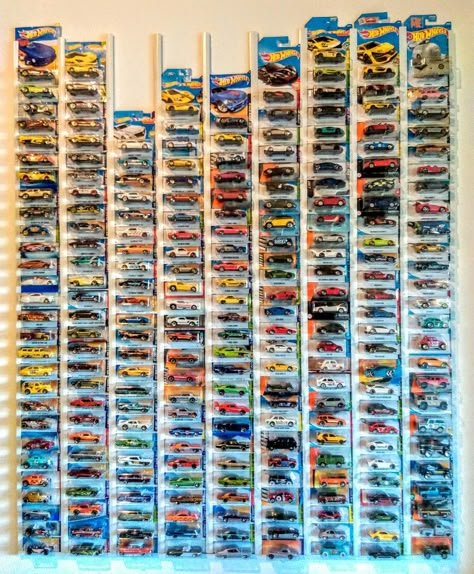 My current Hot Wheels (in original packaging) collection October 2019 - on the wall of my study using plastic roof battons (as shown on YouTube). Each row has a different category. From left; Hot Rods & Dragsters - Chevrolet - Buick & Olds & Pontiac & Caddie - Ford & Shelby - Mopar & AMC - British - European - Japanese - Random (4X4 Tooned, Famous Cinematic) ... Hot Wheels Storage Ideas In Package, Hot Wheel Car Display Ideas Diy, Hot Wheels Display In Package, Hot Wheel Car Display Ideas, Hot Wheel Collection Wall, Hot Wheel Displays, Hot Wheels Storage Ideas Diy, Hot Wheel Wall Display, Hot Wheels Collection Display