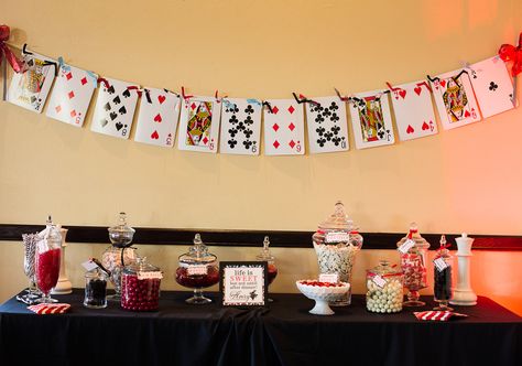 jumbo playing card garland and candy bar with red, white and black candy Giant Playing Cards Decoration, Playing Card Party Decorations, Diy Giant Playing Cards, Playing Card Themed Party Ideas, Playing Card Garland, Euchre Party, Card Garland, Large Playing Cards, 8th Grade Dance