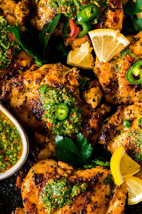 Chicken Thighs with Chimichurri Sauce served on a black plate Chimichuri Sauce, Chimichurri Chicken, Pork Medallions, Beef Strips, Chilli Peppers, Chimichurri Sauce, Perfect Dinner, Baked Chicken Thighs, Dinner Inspiration