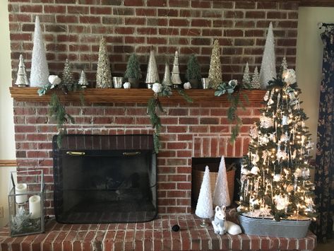 Mercury glass Christmas tree mantel Glass Christmas Trees Mantel, Mantel With Christmas Trees, Mantel Christmas Trees, Christmas Tree Mantel Decor, Christmas Mantels With Trees, Mercury Glass Christmas Trees Display, Christmas Trees On Mantle, Tree Mantle Decor, Mantle Christmas Decor Ideas