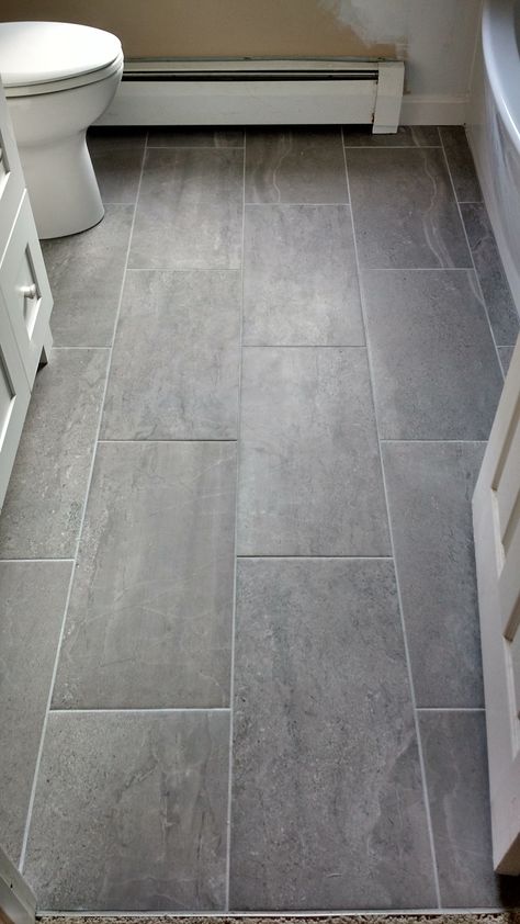 Bathroom renovation complete with grey large format tile with contrast grout lines. Large Tile Bathroom, Grey Bathroom Floor, Laundry Room Tile, Grey Bathroom Tiles, Grey Floor Tiles, Bathroom Redesign, Large Tile, Large Format Tile, Bathroom Remodel Designs