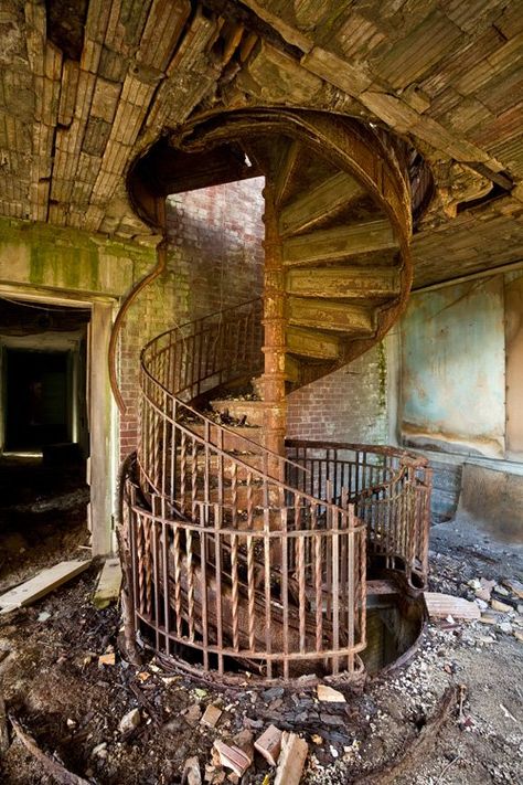 GREAT RUSTY SPIRAL STAIRCASES, BATMAN!   North Brother Island, an abandoned island near Queens, NY used to be an old quarrentine center in Typhoid times. Reopened again briefly in the 1950's as a rehab center, but abandoned for the final time in 1963. Photographic tour of the decayed buildings. Abandoned Asylums, Abandoned House, Spiral Stairs, Abandoned Mansions, Chernobyl, Stairway To Heaven, Haunted Places, Spiral Staircase, Abandoned Buildings