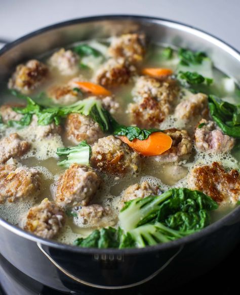 GINGER PORK MEATBALL SOUP WITH BOK CHOY - Ginger is the star of this delicious, simple, and comforting pork meatball soup recipe where tender bok choy is cooked in a savoury, flavourful broth. #soup #meatballsoup #pork #bokchoy #souprecipes #dinnerrecipes #easyrecipes #ginger Bokchoy Soup Recipes, Asian Meatball Soup Recipes, Asian Pork Meatball Soup, Asian Meatballs Soup, Chinese Meatball Soup, Vietnamese Meatball Soup, Chinese Pork Soup, Asian Meatball Soup, Pork Broth Soup Recipes