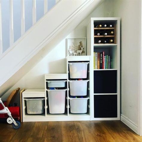 a cool way to use IKEA KALLAX shelves under stairs Ikea Under Stairs, Under The Stairs Storage, Living Room Under Stairs, Shelves Under Stairs, Under Stairs Storage Solutions, Ikea Kallax Shelving, Room Under Stairs, Space Under Stairs, Stair Nook