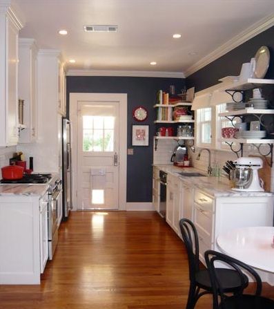 The contrast of denim blue and white, mixed with the warm wood floors...inviting Dark Blue Kitchen Walls White Cabinets, Blue Wall White Cabinet Kitchen, Navy Kitchen Walls White Cabinets, Blue Kitchen Walls White Cabinets, Blue Kitchen Paint, Blue Kitchen Walls, Navy Blue Kitchen, Navy Kitchen, Diy Kitchen Backsplash