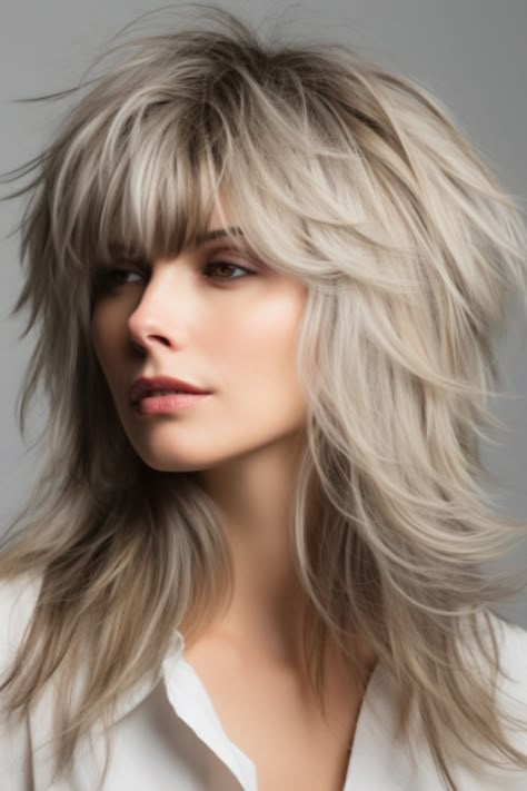 A long shag with chunky layers offers a fresh take on the boho chic vibe. The chunky layers provide a stylish texture that perfectly complements long hair. Click here to check out more trending wolf haircut ideas for 2023. Cool Hairstyles For Long Hair Easy, Wolf Haircut Long Hair With Bangs, Modern Long Shag Haircut Fine Hair, Messy Long Bob Hairstyles, Wolf Haircuts, Shaggy Rocker Hair, Blonde Shag Hairstyles, Layered Hair For Thinner Hair, Boho Shag Haircut