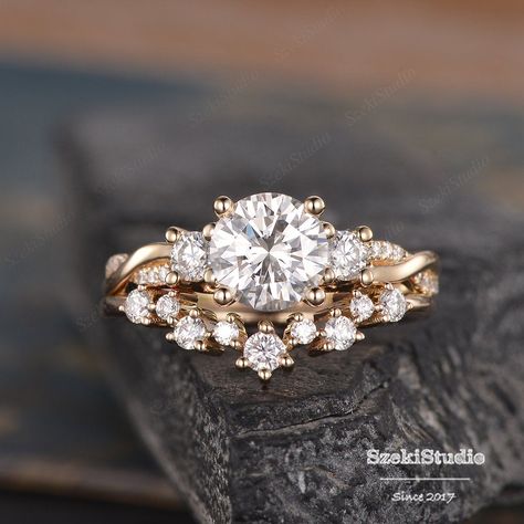 "Three Stone Moissanite Engagement Ring Set Infinity Rose Gold Cluster Moissanite Ring Twist Diamond Half Eternity Ring Bridal Woman Promise ITEM INFORMATION Metal Type - Solid 14k Rose Gold Band Width - (approx. 1.8mm) Engagement ring: Center Stone - 7mm Moissanite, Round Cut Clarity - VVS Color - D-E-F Side Stone - Moissanite Weight - 0.2ct Clarity - D-E-F Color - VVS Accent Stone -Natural Diamonds Weight - 0.1ct Clarity - SI Color - H Wedding Band: Stone -Natural Diamonds Weight - 0.24ct Clar Unique Rose Gold Rings, Rose Gold Engagement Ring And Wedding Band, White And Rose Gold Engagement Rings, Wedding Band Twisted Engagement Ring, Flower Engagement Ring With Wedding Band, Engagement Rings Multiple Bands, Wedding Rings Engagement Infinity, Moissanite Engagement Ring And Wedding Band, Two Band Wedding Ring Set