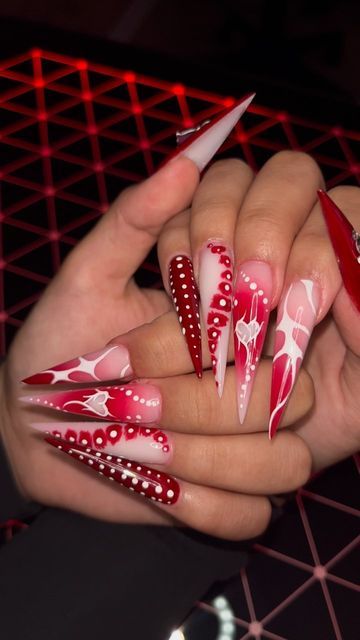 Oregon Freestyle Nail Artist • Oscar Rocha on Instagram: "Freestyles Only. “Feels good, you should try it.” 🩸 - @pinkdollynails Using @valentinobeautypure Gel Polish 123, 180, 045, 002, 003 . Use Link in Bio 🕷️Discount Code: NAILEDIT🕷️ . #valentinobeautypure #teamvalentino #nails #nailvideos #salemoregon #portlandoregon #pdxnails #pdxnailtech #greshamnails #clackamasnails #nailtrend #fallnails #brownnails #acrylicnails#explorepage #viral #nailhacks #nailart #auranails #vdaynails #valentinesda Stiletto Vday Nails, Junk Valentines Nails, Valentines Day Nails Airbrush, Stiletto Valentine Nails, Valentines Junk Nails, Valentine’s Day Nails Stiletto, Acrylic Freestyle Nails, Celebratory Nails, Valentines Nails Stiletto