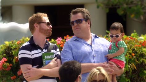 Modern Family. Cam, Lily and Mitchell. <3 . Always Fabulous. Modern Family Mitch And Cam, Cam And Mitchell, Cam Modern Family, Mitchell Pritchett, Peyton Clark, American Humor, Closer To The Sun, Real Family, Tv Show Outfits