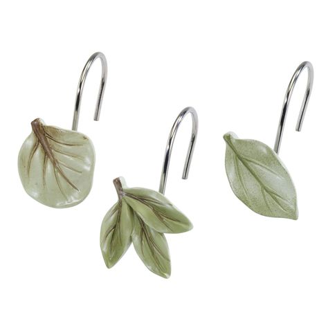 The Avanti Ombre Leaves Shower Curtain Hooks feature 3 different shaped leaves in various shades of green, the perfect complement to the Ombre Leaves shower curtain. Set of 12, 4 of each design. Made of durable resin. Imported. Apt Bathroom Ideas, Frog Bathroom Decor, Birch Bark Decor, Witchy Bathroom, Bathroom Redecorating Ideas, Frog Bathroom, Forest Bathroom, Wood Silhouette, Luxury Shower Curtain