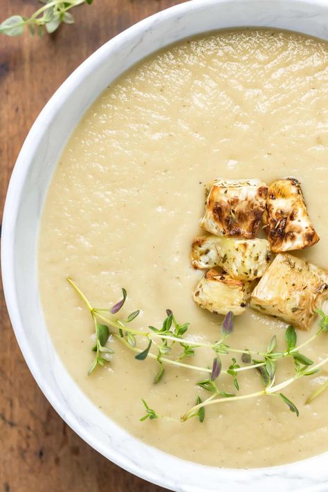 This easy, creamy blended Celeriac Soup recipe makes the most of seasonal celery root. It’s roasted, then blended with garlic, thyme, and vegetable stock for a velvety soup that is warm and comforting, and easy to make! Naturally vegan. Celeriac Soup Recipes, Celeriac Recipes, Roast Celeriac, Celeriac Soup, Celery Recipes, Celery Root, Soup Maker, Lean Belly Juice, Celery Soup