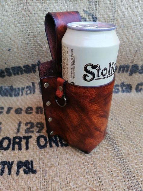 Introducing our handcrafted leather Bottle Holder - the perfect accessory for any summer outing! This unique beer holder is made entirely by hand from natural leather that has been hand-dyed, giving each piece a one-of-a-kind keto finish. Designed with convenience in mind, this bottle holder features a lifetime guarantee and ensures that your drink is always at your fingertips. Whether you're heading to summer festivals, competitions, concerts, or simply taking a stroll in the park, this versati Beer Can Holder Hat, Yeti Beer Can Holder, Beer Flight Holder, Leather Beer Holder, Leather Bottle Holder, Beer Can Holder, Beer Holder, Summer Festivals, Can Holder