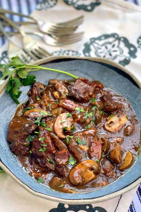 This easy beef bourguignon recipe, from French chef Ginette Mathiot, will take you 20 minutes to prep, and it makes the most incredible stew, with rich flavorful broth and meltingly tender beef #BeefBourguignon #BeoufBourguignon #AuthenticBeefBourguignon #EasyRecipe Easy Party Food Recipes, Beef Stew Bourguignon, Easy Beef Bourguignon, Beef Bourguignon Recipe, Party Food Recipes, Hearty Stew, Easy Party Food, Tender Beef, Hearty Stews