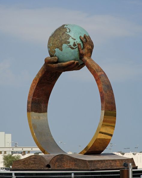 The "Rise Through Education" sculpture by Lorenzo Quinn, Spain ~.~ Monument Ideas, African Decor Living Room, Lorenzo Quinn, Park Signage, School Board Decoration, Architectural Signage, Front Garden Design, Architectural Sculpture, Cement Art