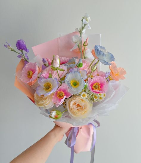 this was one of the first big bouquets we worked when our colourful poppy bouquet started to become popular and on avg it took me 3-4 hours to get one right. One of my biggest advice for aspiring florists is to practice as much as you can 💗🌷 Small Whimsical Bouquet, Colourful Flower Arrangements, Unique Bouquet Ideas, Poppies Bouquet, Poppies Flower, Colorful Flowers Arrangements, Flower Shop Decor, Poppy Bouquet, Bouquet Arrangement