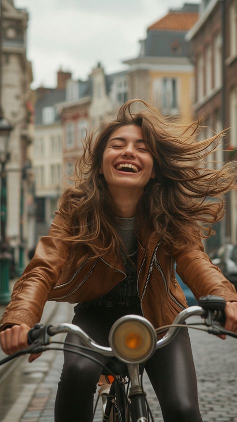 Joyful Urban Cycling: urban cycling, cheerful woman, flowing hair, quaint street, cobblestone road, city exploration, carefree spirit, historic buildings, leather jacket, casual fashion, genuine smile, windblown hair, bicycle ride, vibrant city, youthful joy #joyful #cycling #woman #hair #bike #aiart #aiphoto #stockcake ⬇️ Download and 📝 Prompt 👉 https://ayr.app/l/T16Z Bike Fashion Photography, Cycling Photography Women, Woman On Bike, Bike Portrait, Windblown Hair, Cobblestone Road, Woman Cycling, Cycle Photo, Bicycle Photography