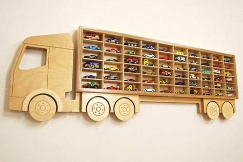 Do you have kids who love Hot Wheels and Matchbox cars? Or perhaps there’s a kid-at-heart in the household who collects these toy cars? Then this toy storage idea collection is for you! Anyone who lives with someone who just can’t seem to have enough toy cars would probably agree that it can be bothersome to see these small toys all over the place. Sure, you can get large plastic bins to store them in, but more often than not, kids leave these tiny toys everywhere. Collectors are a different ... Hot Wheels Shelf, Boys Toy Box, Toy Car Display, Toy Car Storage, Hot Wheels Cars Toys, Trendy Toys, Unique Shelves, Presents For Boys, Hot Wheels Toys