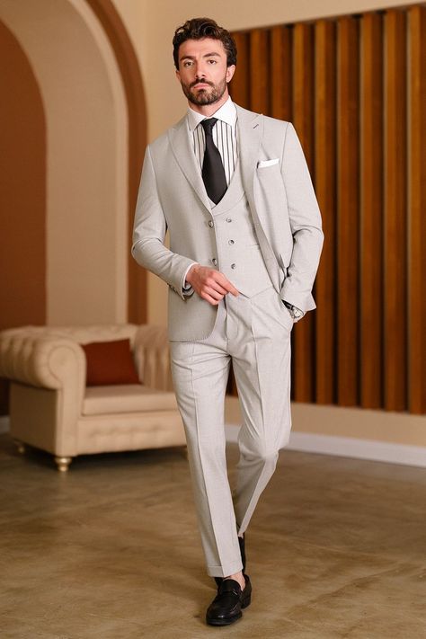 Step into refined elegance and tailored excellence with the Grey Slim-Fit Suit 3-Piece from VIOSSI. Designed for the discerning man, this ensemble's precise slim fit and classic peak lapels exude a timeless aura of professional distinction. #menssuits #tailoredstyle #professionalattire #moderngentleman #VIOSSI #tailoredsuits #sophisticatedlook #mensfashion #sartorialexcellence #peaklapels