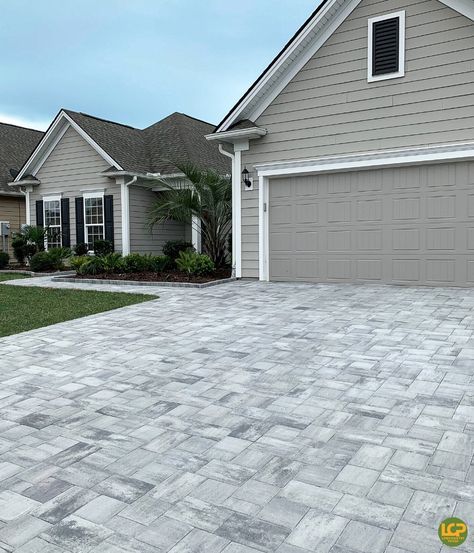 Gorgeous driveway remodel featuring our newest paver color, Charleston Pearl. 😍 Not only do pavers look better than the old concrete, they also increased this homes value!  #lowcountrypaver #drivewaygoals #exteriorinspo #paverdriveway #homesweethome #lowcountryliving #homeimprovements #homeimprovementprojects Driveway Remodel, Paver Colors, Driveway Pavers Design, Old Concrete, Tan House, Paver Designs, Pathway Landscaping, Paver Driveway, House Updates