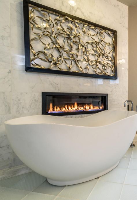 Surround yourself in modern luxury with a napoleon fireplace facing your freestanding bath tub. Seen in Saratoga Hills, an Austin community. Realistic Electric Fireplace, Fireplace Dimensions, Fireplace Facing, Large Fireplace, Wall Mounted Electric Fireplace, Mounted Electric Fireplace, Bedroom With Bath, Cozy Bathroom, Mounted Fireplace