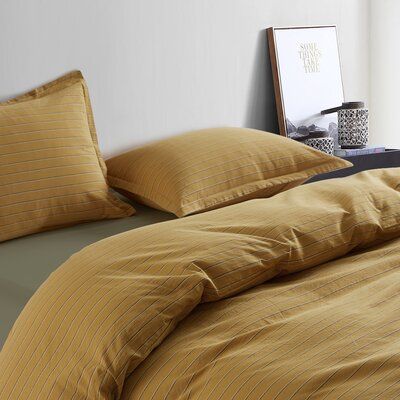 Modern relaxed fit style cotton duvet cover bedding set by getting Bed Ready. Made from soft stone-washed 100-percent cotton chambray fabric in a timeless striped pattern. Protect your duvet insert while keeping comfy and safe. Our much-loved Stonewashed Cotton is made from a 100% cotton fabric, using a prewashed method to give a worn-in look and soft feel finish. This fabric becomes softer with every wash & use, that is breathable all year round - making it the perfect summer sheet, or ultimate Peach Bedding, Mustard Bedding, California King Duvet Cover, Minimalist Studio, 100 Cotton Duvet Covers, Yellow Bedding, Striped Duvet Covers, Bedroom Setup, Chambray Fabric