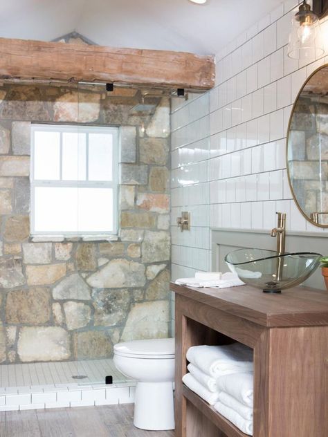 Stone from the house's old exterior is used to line a bathroom wall. Raleigh Homes, Bathroom Joanna Gaines, Joanna Gaines Bathroom, Fixer Upper Bathroom, Simple Bathroom Designs, Bathroom Paint Colors, Chip And Joanna Gaines, Bowl Sink, Farmhouse Bathroom Decor