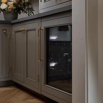 Cottage Pantry with Brass Towel Rod and Hooks - Cottage - Kitchen Dark Taupe Kitchen Cabinets, Ashley Montgomery Design, Cottage Pantry, Ashley Montgomery, Taupe Kitchen Cabinets, Iron Shelves, Taupe Kitchen, Black Countertop, Inset Cabinetry