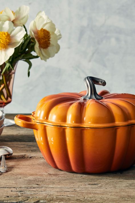 Inspired by a timeless fairy tale design and the brilliant colors of autumn, the Le Creuset Pumpkin Cocotte is a delightful seasonal addition to your kitchen and table. With its unique ribbed design and hand sculpted stainless steel figural knob, the versatility of this pot makes it ideal for everything from comforting soups and stews to braising, Halloween baking and more. Roast Chicken Sauce, Pumpkin Cocotte, Pumpkin Casserole, Autumn Kitchen, Enameled Cast Iron Cookware, Black Pumpkin, Comfort Soup, Sauce For Chicken, Cast Iron Dutch Oven