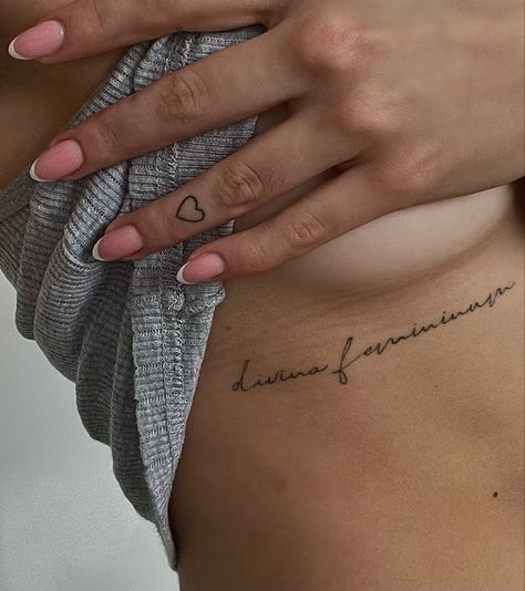 Divine Feminine Rib Tattoo, Feminine Rib Tattoos For Women, Writing Rib Tattoo, Ribbed Tattoo, Bra Line Tattoos For Women, The Divine Feminine Tattoo, Side Body Tattoos For Women Ribs, Feminine Rib Tattoos, Rib Writing Tattoo