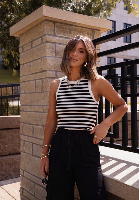 This striped crop tank is perfect for a business casual look. Its classic striped pattern adds a stylish touch while its cropped design allows for easy movement. A must-have addition to any wardrobe. Fabric 85% acrylic, 15% polyester Black And White Stripe Top Outfit, Striped Top Outfit Summer, Striped Tank Outfit, Black And White Striped Top Outfit, Stripe Top Outfit, Sweater Tank Top Outfit, Striped Tank Top Outfit, Black Tank Tops Outfit, Sleeveless Top Outfit