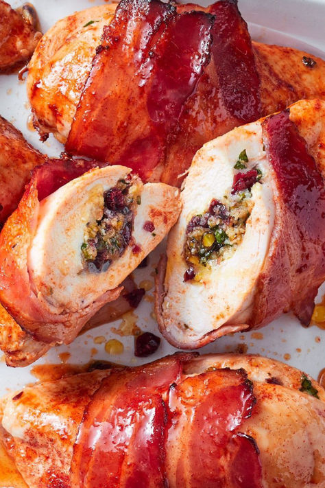 Prep ahead these sweet, sticky and Christmassy chicken parcels. Stuff and wrap your chicken a day ahead and store in the fridge, then just sprinkle and bake. A little paprika adds richness and colour to your sugary crust, and the cranberry and pistachio stuffing is packed with traditional Christmas flavour. Christmas Chicken Ideas, Christmas Stuffed Chicken, Chicken Parcels, Holiday Finger Foods, Cultural Foods, Christmas Finger Foods, Christmas Main, Christmas Chicken, Festive Food