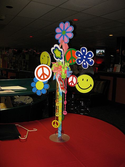 60's theme Hippy love centerpiece by The Prop Factory, via Flickr 60s Party Themes, Hair Musical, Woodstock Party, Flower Power Party, Decades Party, Hippie Birthday Party, 70s Party Theme, 70s Theme Party, 60s Theme