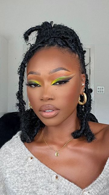 Natori Makeup, Uche Natori, Pop Of Color Under Eye Makeup Black Women, Uche Natori Makeup, Green Eyeliner Looks, Green Makeup Looks Black Women, Green And Yellow Makeup Looks Black Women, Green Eye Makeup Looks, Yellow Eye Makeup Dark Skin